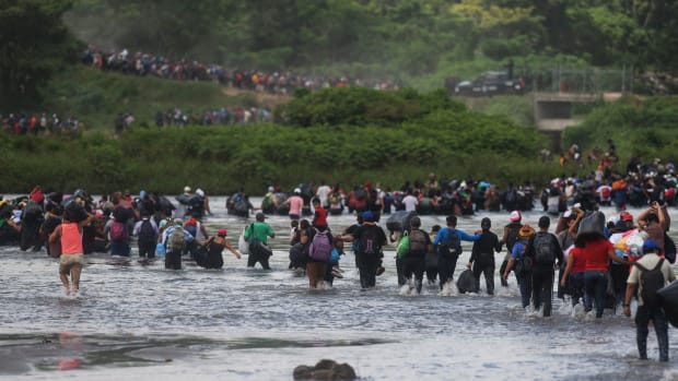 Salvadorean migrants heading in a caravan to the U.S., cross the Suchiate River to Mexico.