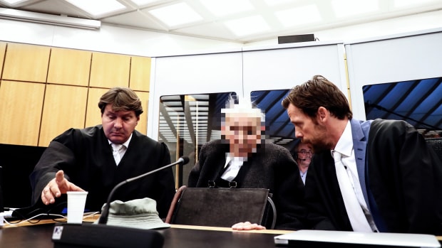 Defendant Dr. Johann R., whose face is pixelated by court order, sits with his lawyers at a session of his trial at the Regional Court in Muenster, Germany, on November 6th, 2018. The 94-year-old former SS guard faces trial, charged with complicity in the mass murders at the Nazi concentration camp Stutthof during World War II. Johann R. was a watchman at the Nazi camp near what was then the free city of Danzig, now Gdansk, in Poland. He also stands accused of complicity in the murders of several hundred camp prisoners between 1942 and 1945. As the former SS guard was not yet 21 at the time of the crimes, he will be tried before a juvenile court.