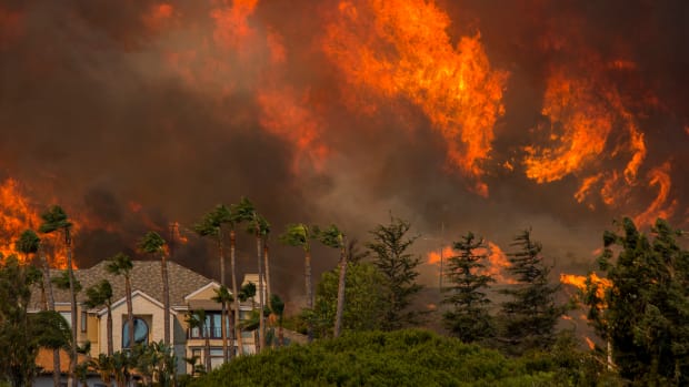 The Woolsey fire approaches homes on November 9th, 2018, in Malibu, California.
