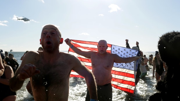 Polar Bear Club swimmers make their annual icy plunge into the Atlantic Ocean on New Year's Day at Coney Island in the Brooklyn borough of New York City.
