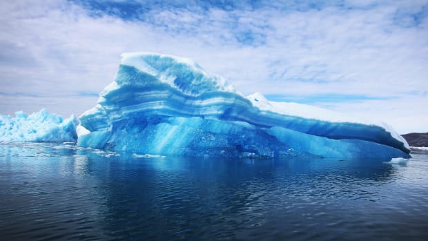 Calved icebergs from the nearby Twin Glaciers are seen floating on the water in Qaqortoq, Greenland.