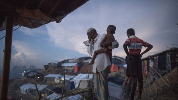 Rohingya Muslim refugees look at the hundreds of tents filling a refugee camp in Bangladesh's Ukhiya district on October 4th, 2017.