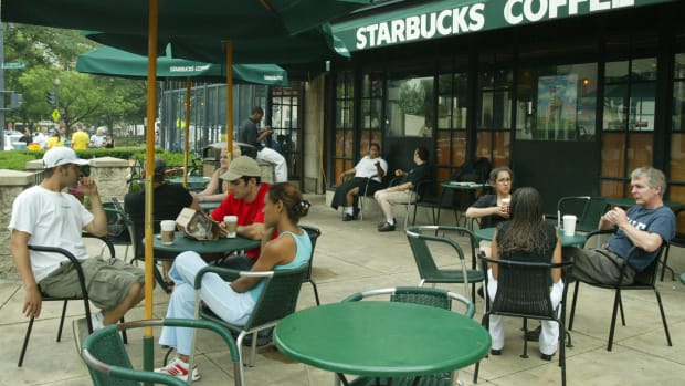 Customers sit outside a Starbucks in Washington, D.C.