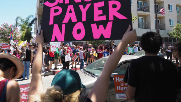 People rally in favor of single-payer health care outside of the office of Speaker of the California State Assembly Anthony Rendon on June 27th, 2017, in South Gate, California.