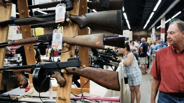 Gun enthusiasts visit a gun show where thousands of different weapons are displayed for sale on July 10th, 2016, in Fort Worth, Texas.