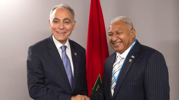 Salaheddine Mezouar (left), the Moroccan minister of foreign affairs, shakes hands with Frank Bainimarama, prime minister of Fiji, at the COP22 climate conference in Marrakech, Morocco, on November 18th, 2016.