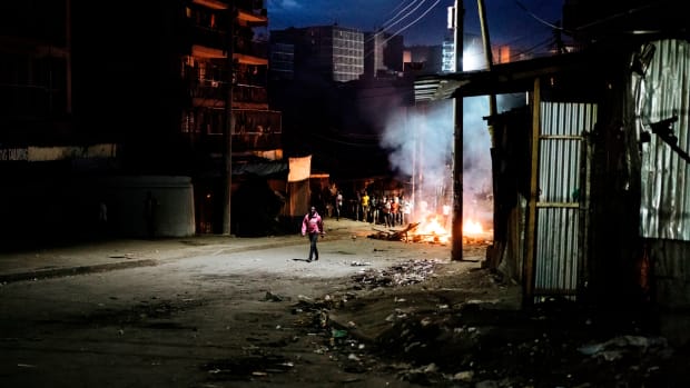 Protesters gather around a burning barricade in the Mathare slums in Nairobi, Kenya, on October 30th, 2017, during demonstrations following the announcements of the presidential election results.