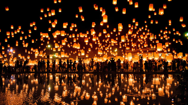 A crowd releases lanterns into the air to celebrate the Yee Peng festival, also known as the Festival of Lights, in the city of Chiang Mai in Northern Thailand on November 3rd, 2017.
