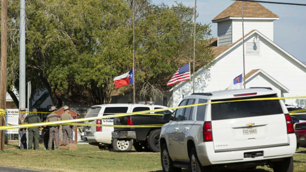 Law enforcement officials gather near the First Baptist Church following a shooting on November 5th, 2017, in Sutherland Springs, Texas.