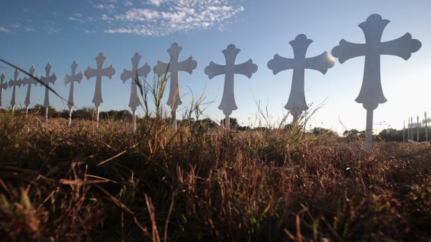Crosses stand in a field on the edge of town to honor the 26 victims killed at the First Baptist Church on November 6th, 2017, in Sutherland Springs, Texas.