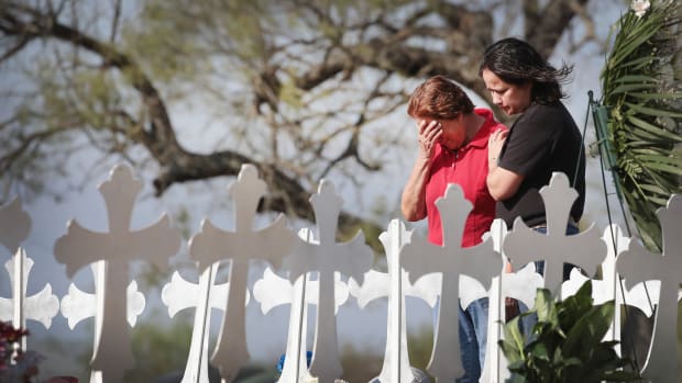 Maria Durand and her daughter, Lupita Alcoces, visit a memorial on the edge of town honoring the 26 worshippers killed at the First Baptist Church on November 7th, 2017, in Sutherland Springs, Texas. Durand, who teaches bible study at the church, lost several friends in the shooting.