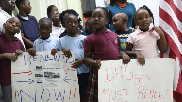Children hold posters asking the federal government to renew Temporary Protected Status during a press conference about TPS for people from Haiti, Honduras, Nicaragua, and El Salvador at the office of the Haitian Women of Miami on November 6th, 2017, in Miami, Florida.