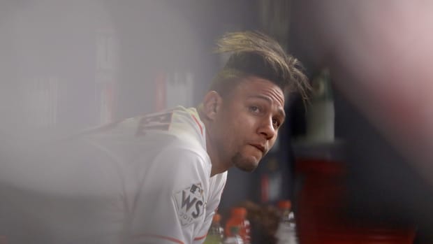 Yuli Gurriel looks on from the dugout during the fourth inning against the Los Angeles Dodgers in game five of the World Series at Minute Maid Park on October 29th, 2017, in Houston, Texas.