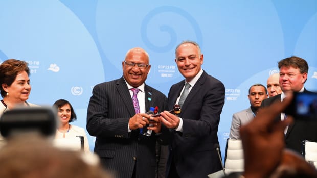 Salaheddine Mezouar (right), Moroccan foreign minister and president of COP22, hands over a symbolic hammer to Frank Bainimarama (left), prime minister of Fiji and president of COP23, during the opening session of the COP23 United Nations Climate Change Conference on November 6th, 2017, in Bonn, Germany.