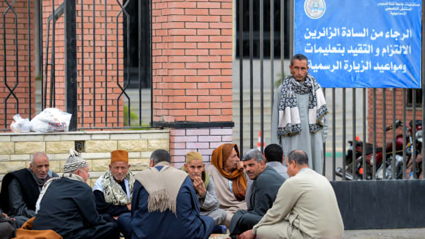 Relatives of the victims of the bomb and gun assault on the North Sinai Rawda mosque wait outside the Suez Canal University hospital in the eastern port city of Ismailia on November 25th, 2017.