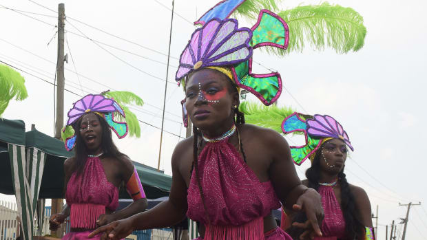 Performers dance during the Lagos Street Carnival on December 3rd, 2017, in Lagos. Commercial activities in the bustling Ikeja district of Lagos were grounded as people danced along the major roads to celebrate the second edition of the Lagos street carnival, heralding the Christmas and New Year's period.