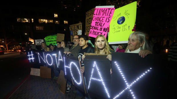 Protesters display signs during a rally against climate skepticism in San Diego, California, on February 21st, 2017.