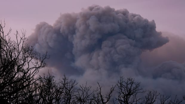 A plume of smoke is seen from Ojai, California, as the Thomas Fire grows and advances toward seaside communities on December 10th, 2017, near Carpinteria, California.
