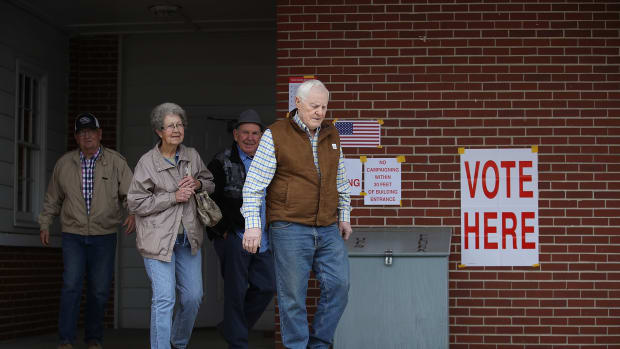 Voters exit after casting their ballots at a polling station setup in the Fire Department on December 11th, 2017, in Gallant, Alabama. Alabama voters are casting their ballot for either Republican Roy Moore or his Democratic challenger Doug Jones in a special election to decide who will replace Attorney General Jeff Sessions in the U.S. Senate.