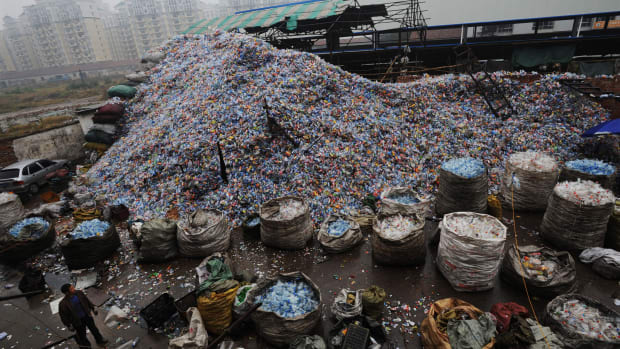 Used plastic bottles remain heaped up at a recycling mill in Wuhan of Hubei Province, China.