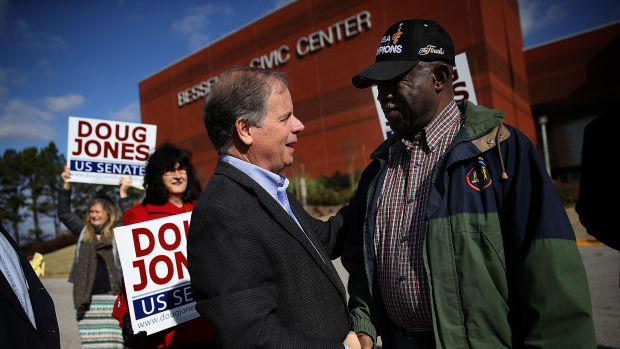 Democratic Senatorial candidate Doug Jones greets voters outside of a polling station at the Bessemer Civic Center on December 12th, 2017, in Bessemer, Alabama.