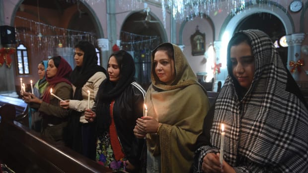 Pakistani Christians take part in a service on December 18th, 2017, for the victims of a suicide attack on a church at the Sacred Heart Cathedral in Lahore.