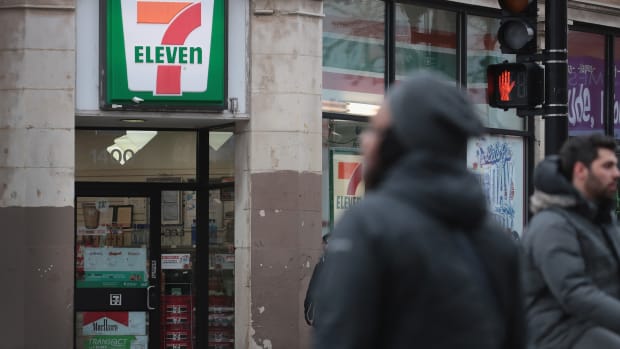 Pedestrians walk past a 7-Eleven store on January 10th, 2018, in Chicago, Illinois.