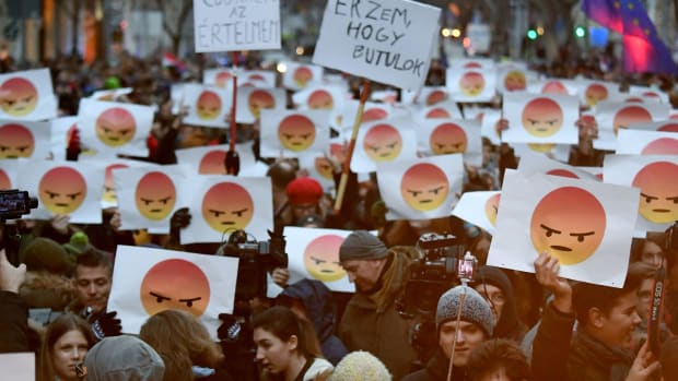 Students hold up signs with angry emoticons to protest against the education policy of the government at the Parliament building in Budapest, Hungary, on January 19th, 2018.