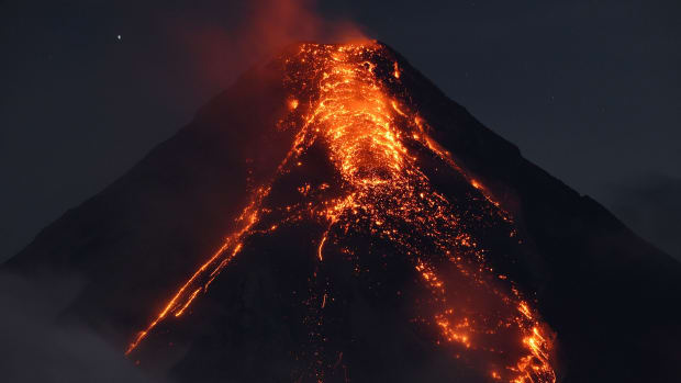 Lava flows from Mount Mayon on January 25th, 2018, as seen from south of Manila, the Philippines. Philippine authorities declared a no-go zone around the volcano after tens of thousands of residents fled to safety.