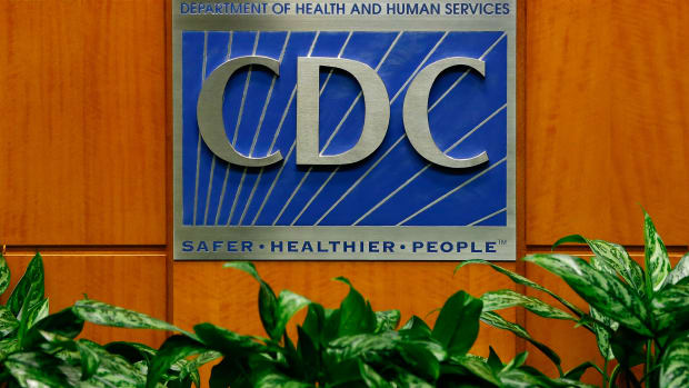 A podium with the logo for the Centers for Disease Control and Prevention.