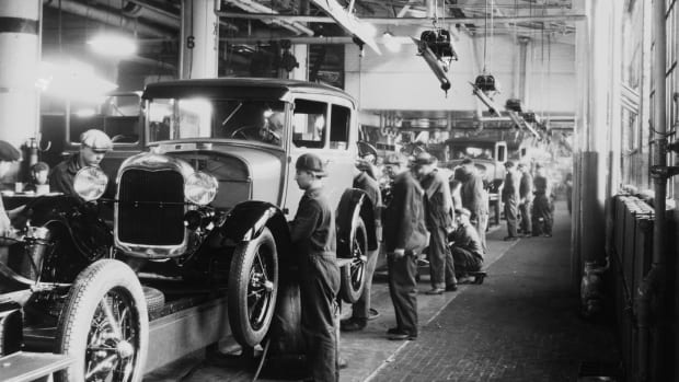 Assembly line workers inside the Ford Motor Company factory in Dearborn, Michigan.