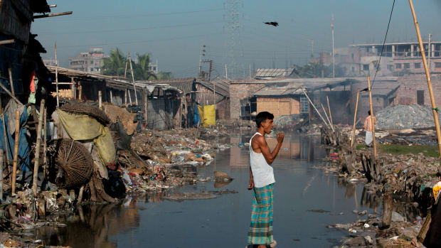 Dhaka, Bangladesh: Momin Mohammad, a leather worker, brushes his teeth by a canal near his home in the city's polluted Hazaribagh neighborhood. Each day, tanneries dump 22,000 liters of toxic waste into the Buriganga, the capital city's main river and key water supply.