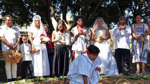 A group of environmental activists hold a traditional ceremony during an event called Marry a Tree, in the community of San Jacinto Amilpas, Mexico, on February 25th, 2018. Marry a Tree began as a ritual of giving thanks to Mother Earth carried out by the organization Bedani; it later gave way to a symbolic wedding based on Inca customs where women and men marry trees in a rite led by Peruvian actor and environmentalist Richard Torres.