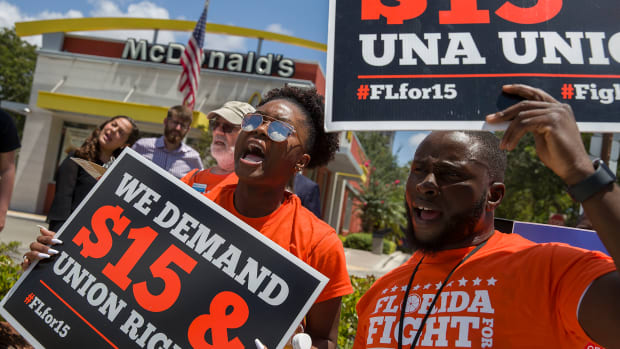 People gather to ask the McDonald’s corporation to raise workers' wages to a $15 minimum wage as well as demand the right to a union on May 23rd, 2019, in Fort Lauderdale, Florida. The nationwide protest was held on the day of the company’s shareholder meeting.