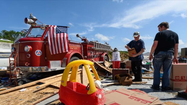 A 1954 American LaFrance fire engine is seen amid the remains of a storage unit on May 23rd, 2019, in Jefferson City, Missouri. The storage building in which Bill Wirtels' fire engine was stored was destroyed.