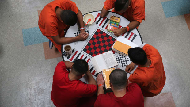 Immigrant detainees at the Adelanto Detention Facility engage in prayer.