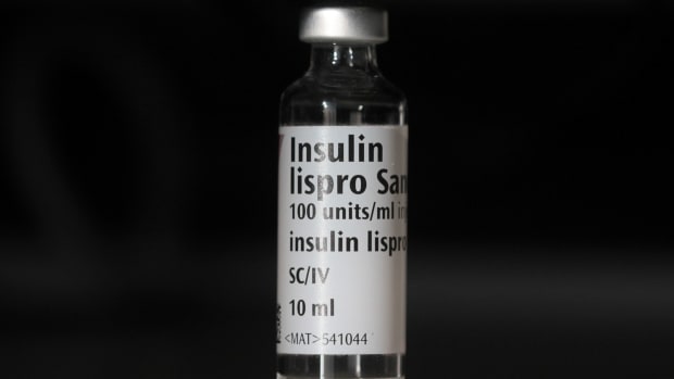 An empty bottle of Insulin lispro by French multinational pharmaceutical company Sanofi is photographed as an arranged illustration in London on February 21, 2019.