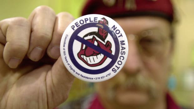 A man protests using Native Americans as mascots for sports teams at the 10th Annual New Years Eve Sobriety Powwow in 2003.