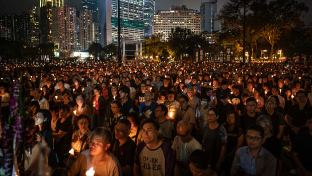 People hold candles as they take part in a candlelight vigil at Victoria Park on June 4th, 2019, in Hong Kong, China. As many as 180,000 people were expected to attend a candlelight vigil in Hong Kong on Tuesday during the 30th anniversary of the Tiananmen Square massacre. Commemorations took place in cities around the world to remember those who died when Chinese troops cracked down on pro-democracy protesters. Thirty years ago, the People's Liberation Army opened fire on protesters in Beijing after hundreds of thousands of students and workers gathered in Tiananmen Square for weeks to call for greater political freedom. No one knows for sure how many people were killed, as China continues to censor any coverage or discussion of the event.