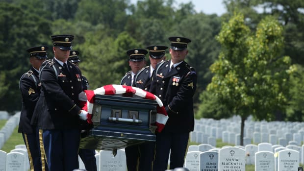 Members of the United States Army's 3rd Infantry Regiment, "The Old Guard," carry the flag-draped casket of World War II Army veteran Carl Mann to his final resting place during his funeral on the 75th anniversary of the D-Day invasion on June 6th, 2019, at Arlington National Cemetery in Arlington, Virginia. Mann, a native of Indiana, was among the troops who stormed Omaha Beach on D-Day during the amphibious landings at Normandy, France. He was awarded with seven Bronze Stars and three Purple Hearts throughout his years of military service.