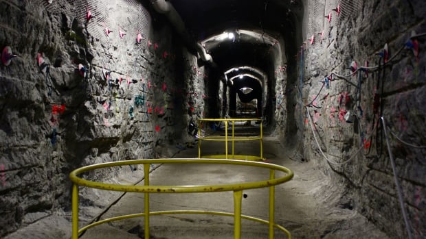Inside the world's first underground repository for highly radioactive nuclear waste, guardrails surround cylindrical burial holes awaiting their lethal deposits.