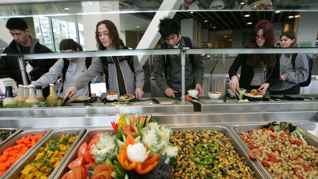 Students at the University of California–Berkeley build salads with organic vegetables at Crossroads dining commons.