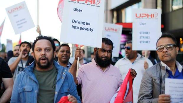 Uber drivers march to Uber's offices in London on October 9th, 2018, with placards and banners from the various trade unions.