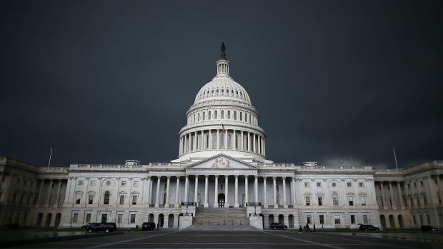 Storm clouds fill the sky over the U.S. Capitol Building.
