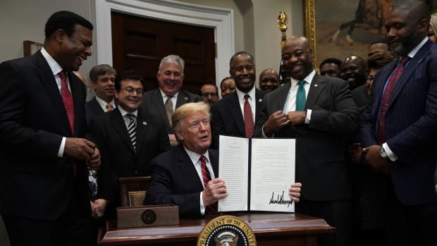 President Donald Trump signs an executive order in December of 2018 to establish the White House Opportunity and Revitalization Council to oversee the opportunity zones program.