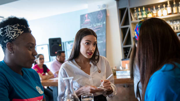 U.S. Representative Alexandria Ocasio-Cortez (D-New York) waits on a table at the Queensboro Restaurant, on May 31st, 2019, in the Queens borough of New York City. Ocasio-Cortez participated in an event to raise awareness for the One Fair Wage campaign, which calls to raise the minimum wage for tipped workers to a full minimum wage at the federal level.