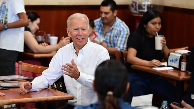Democratic Party candidate Joe Biden gestures while meeting with patrons at a restaurant in Los Angeles on July 19th, 2019.