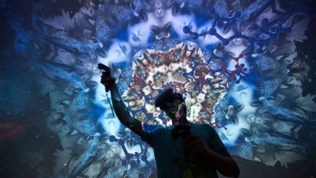 A man tries out a virtual reality game inside a Fulldome.pro 360-degree projection dome on opening day of the Electronic Entertainment Expo at the Los Angeles Convention Center on June 13th, 2017.