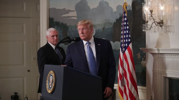 President Donald Trump, followed by Vice President Mike Pence, approaches the podium in the Diplomatic Reception Room of the White House on August 5th, 2019, in Washington, D.C. Trump delivered remarks on the mass shootings in El Paso, Texas, and Dayton, Ohio, over the weekend.