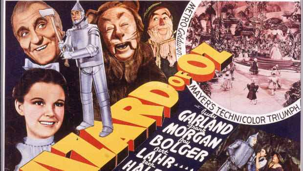 A lobby card from The Wizard Of Oz (1939) shows an illustration of American actress Judy Garland as Dorothy, Frank Morgan as the Wizard, Jack Haley as the Tin Man, Bert Lahr as the Cowardly Lion, and Ray Bolger as the Scarecrow.